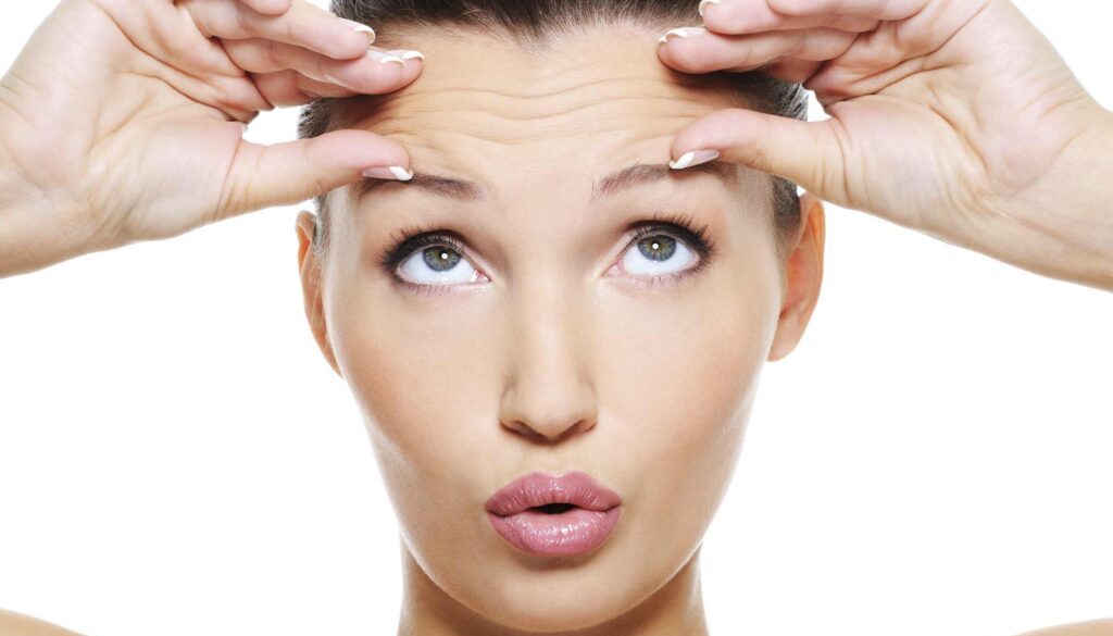 female face with wrinkles on her forehead